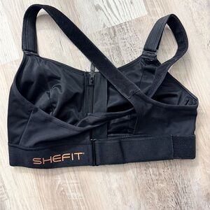 SHEFIT Black Sports Bra with Orange Accents